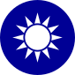 A blue circular emblem on which sits a white sun composed of a circle surrounded by 12 rays.