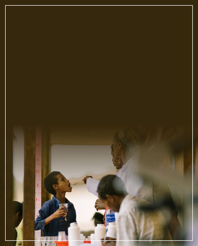 header image of boy being given medication