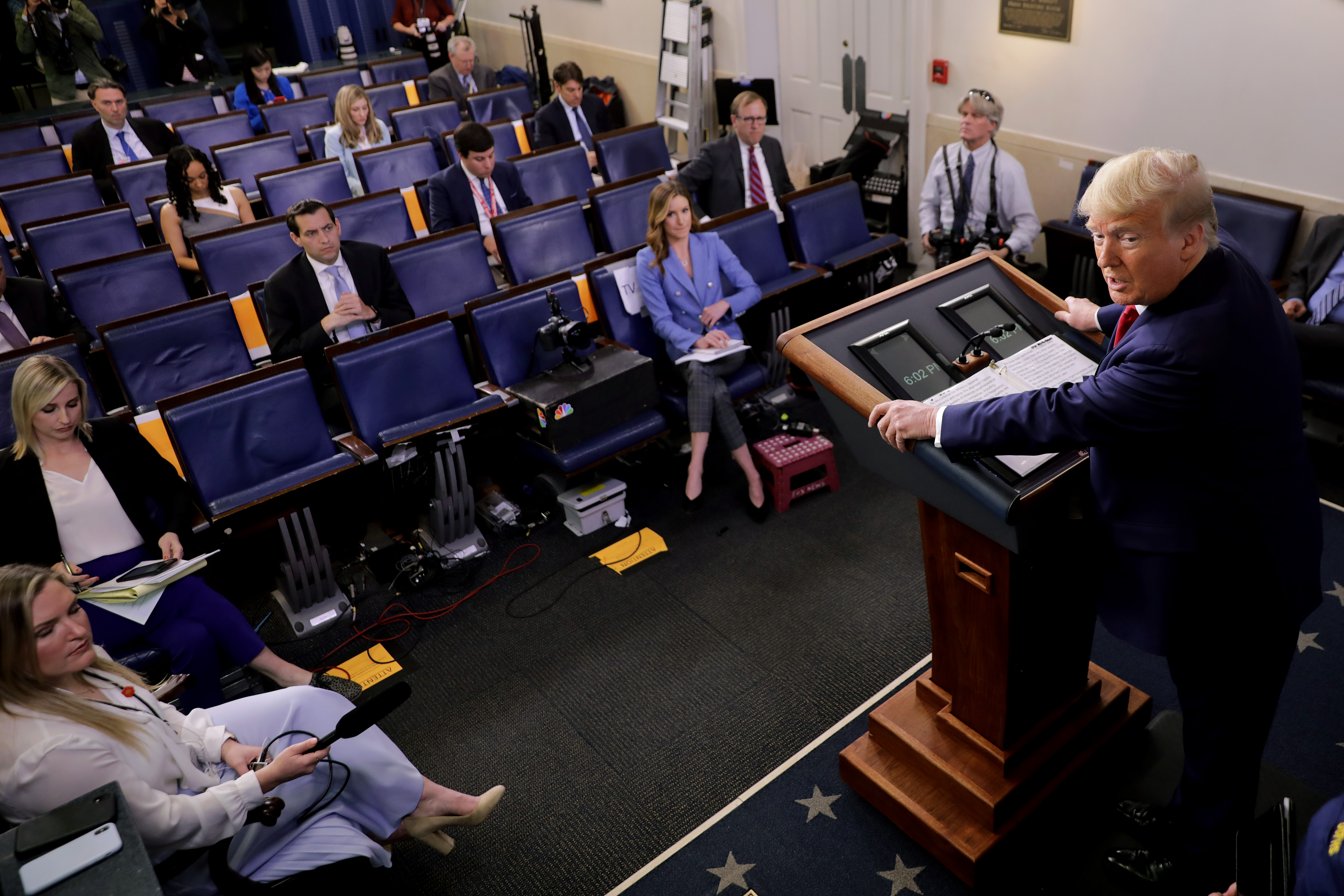 Donald Trump speaks to members of the press.