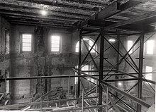 Inside of a building being renovated, with scaffolding