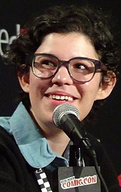 Rebecca Sugar, a smiling, bespectacled young woman