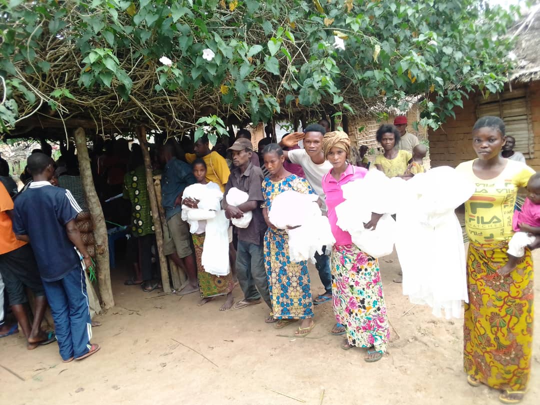 Community members who have received their mosquito nets