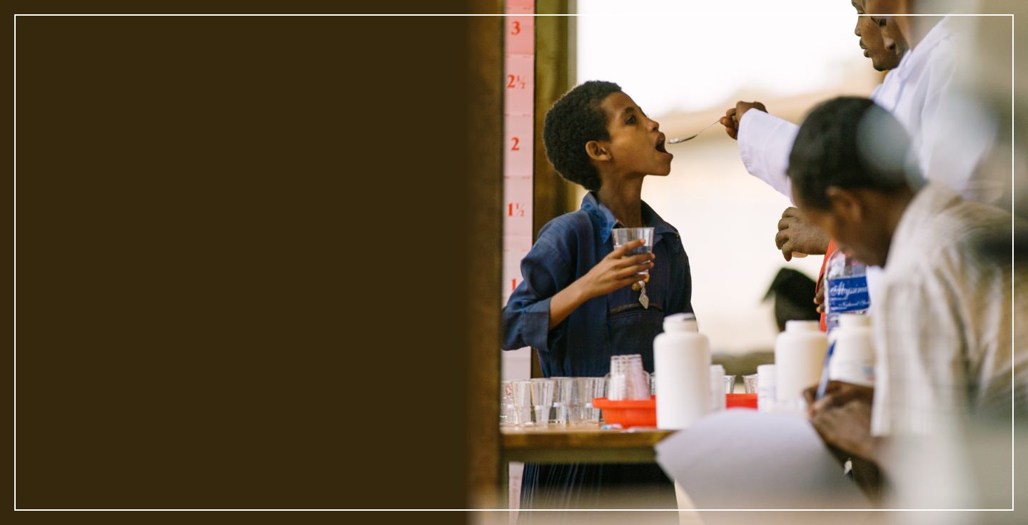 header image of boy being given medication