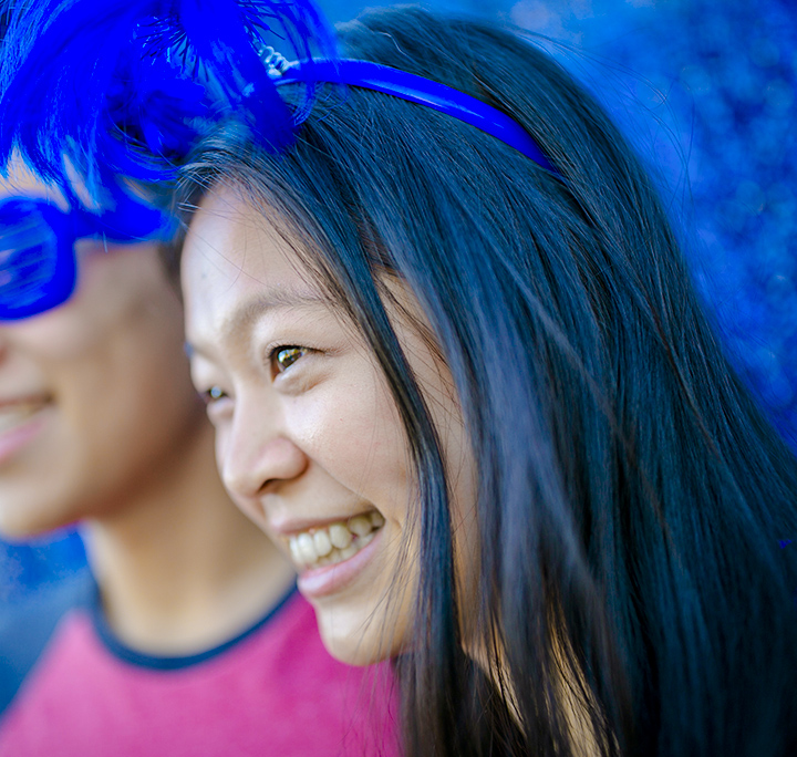 girl smiling and looking away with festive duke blue headband