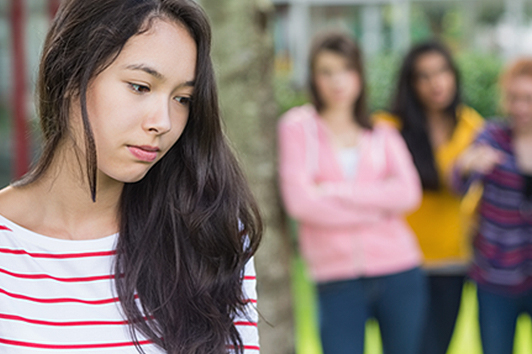 Girl being bullied by other girls.