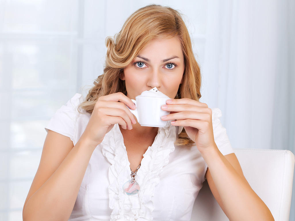 woman drinking cappucino