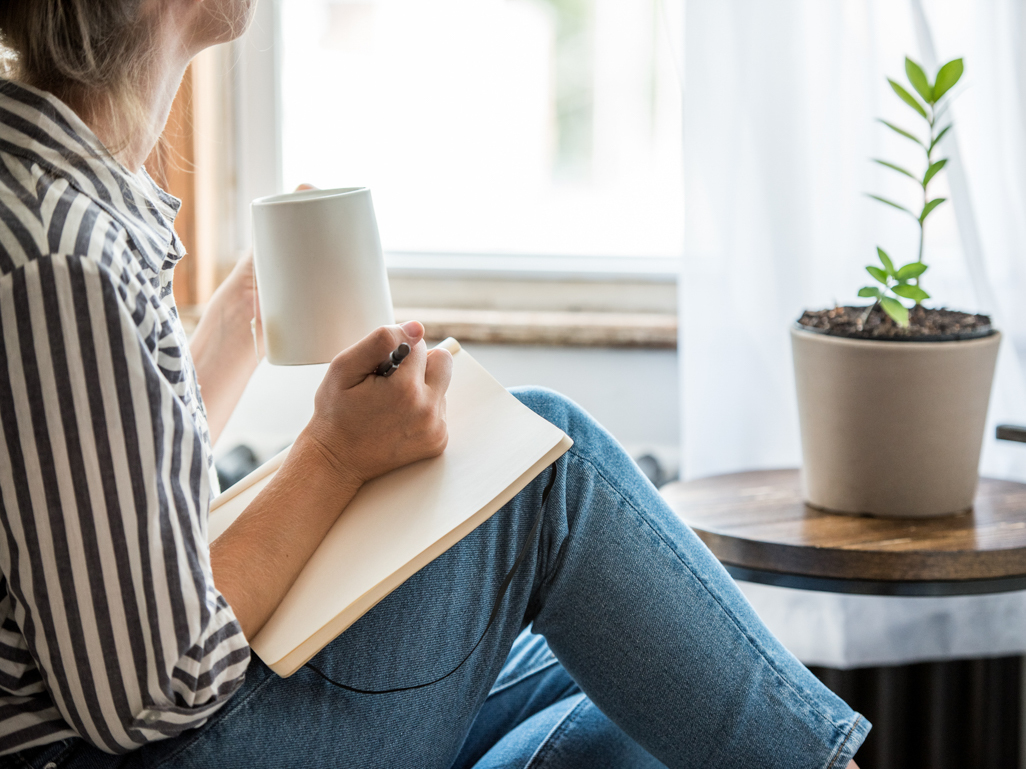 woman writing in a journal