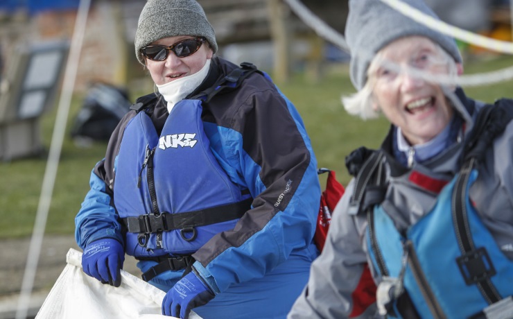 Margaret shows a student the ropes at Hengistbury Head Outdoor Activity Centre