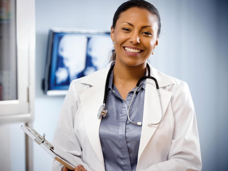 Smiling doctor with clipboard