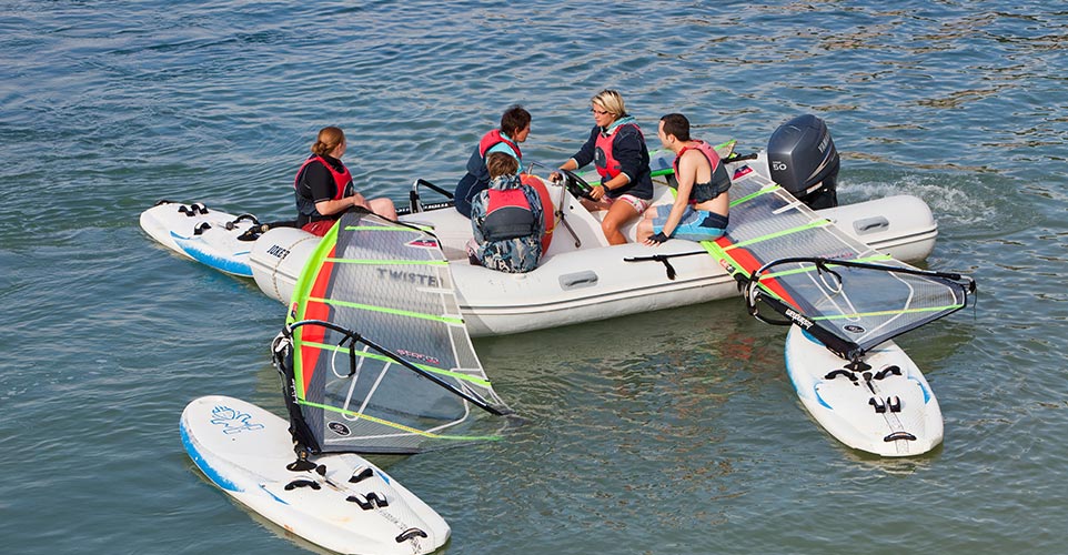 Instructor giving windsurfing lesson