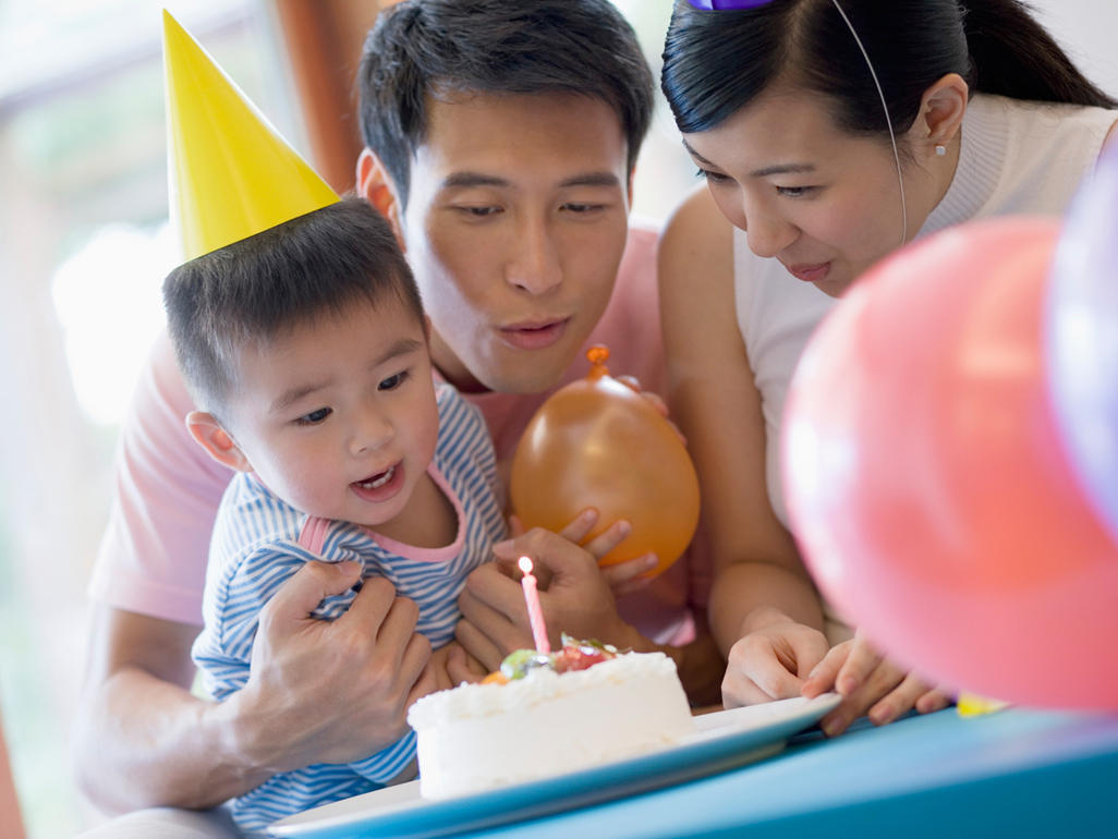 mom and dad celebrating at a birthday party