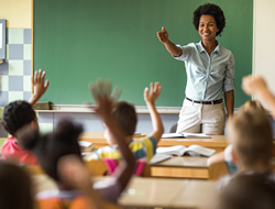 Teacher in classroom with active participants