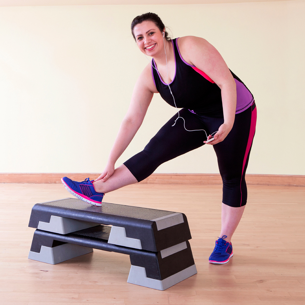 woman in a gym stretching