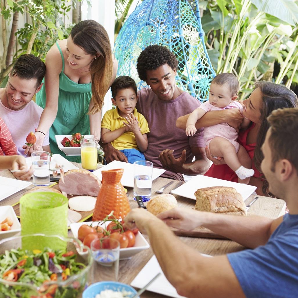 a few families with little children having lunch