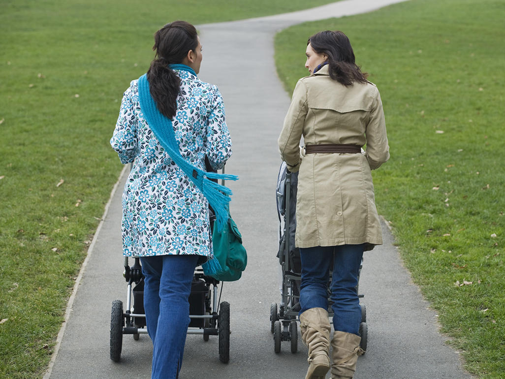 two mothers pushing strollers