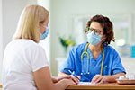 A doctor talks to her patient.