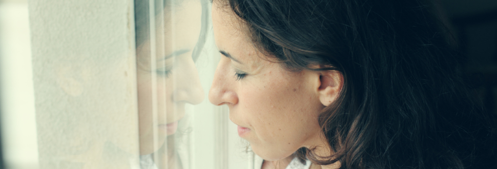 beautiful mother standing near the window