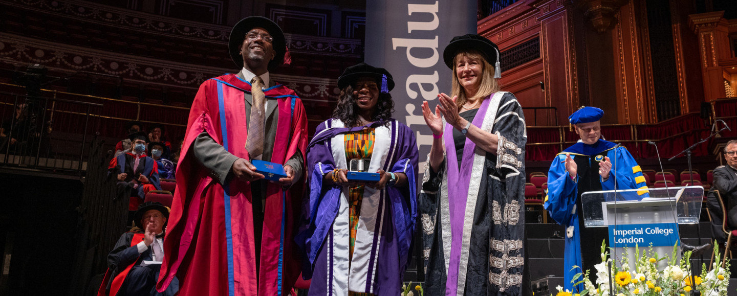 Three people at graduation day