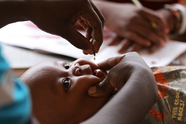 Baby being given vitamin A