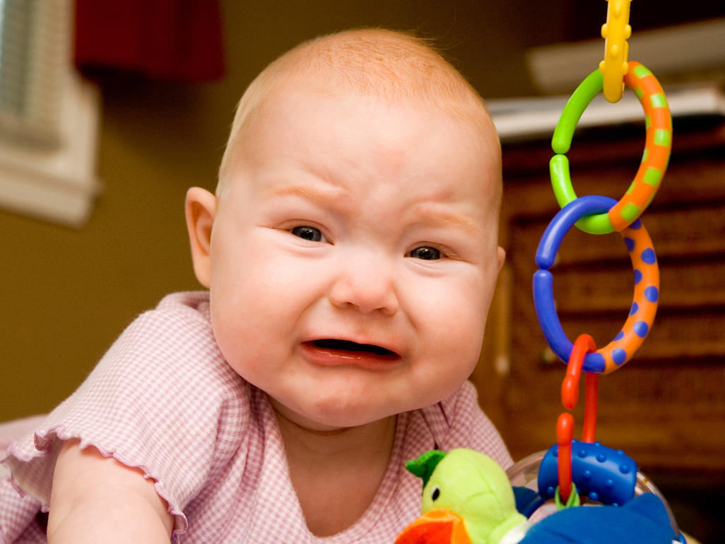 Baby crying on playmat