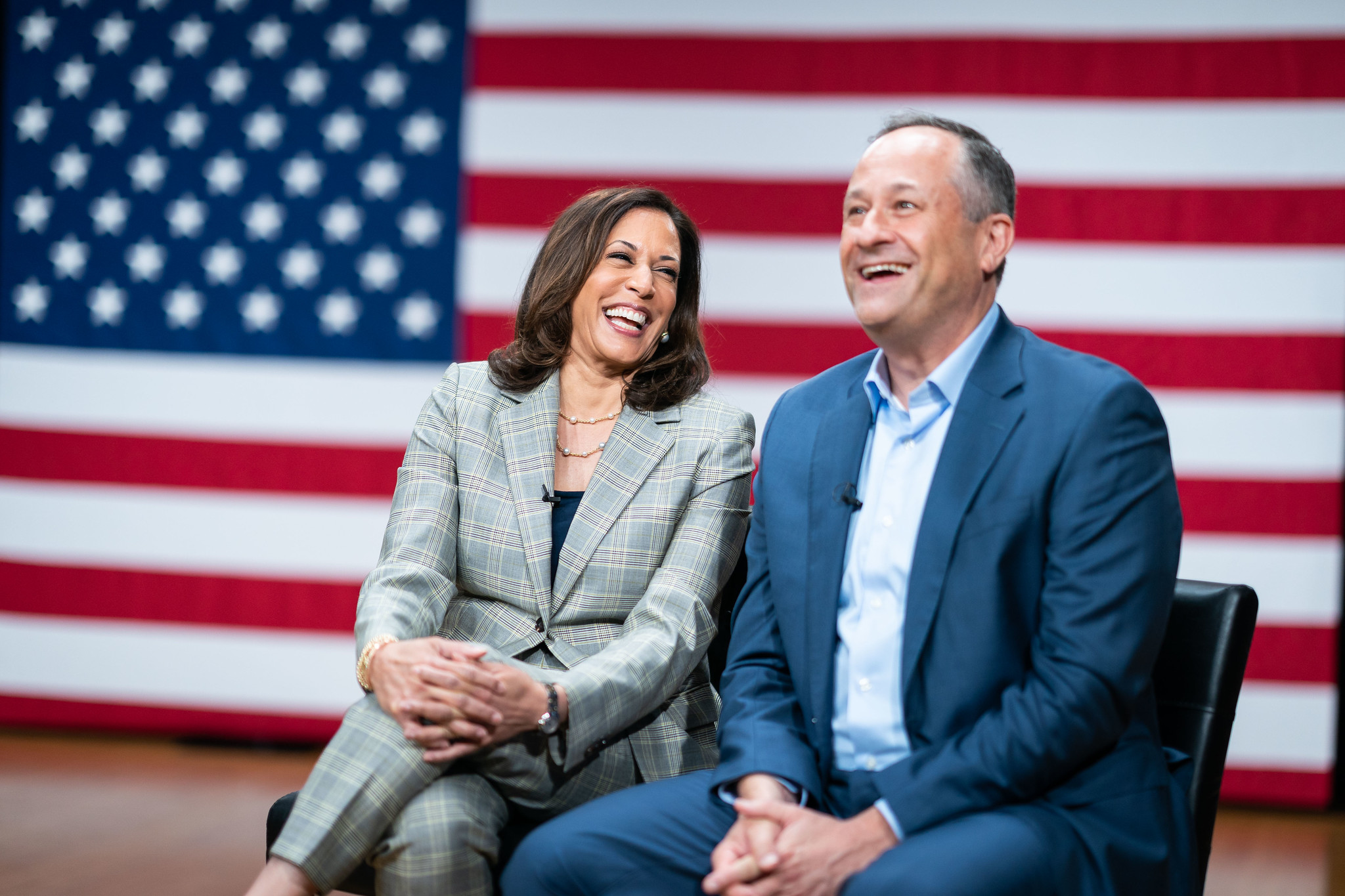 Doug Emhoff (right) sits onstage with his wife, Kamala Harris (left)