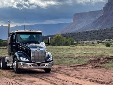 Rough terrain is no problem for the Peterbilt New Model 579 (front) and the newly updated Model 567.