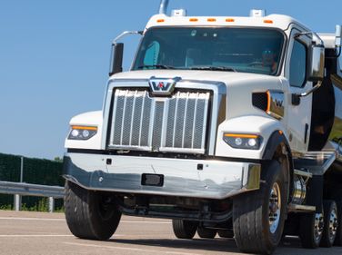 The Western Star 47X is 10 inches shorter and 200 pounds lighter — spec-for-spec — than the 49X.