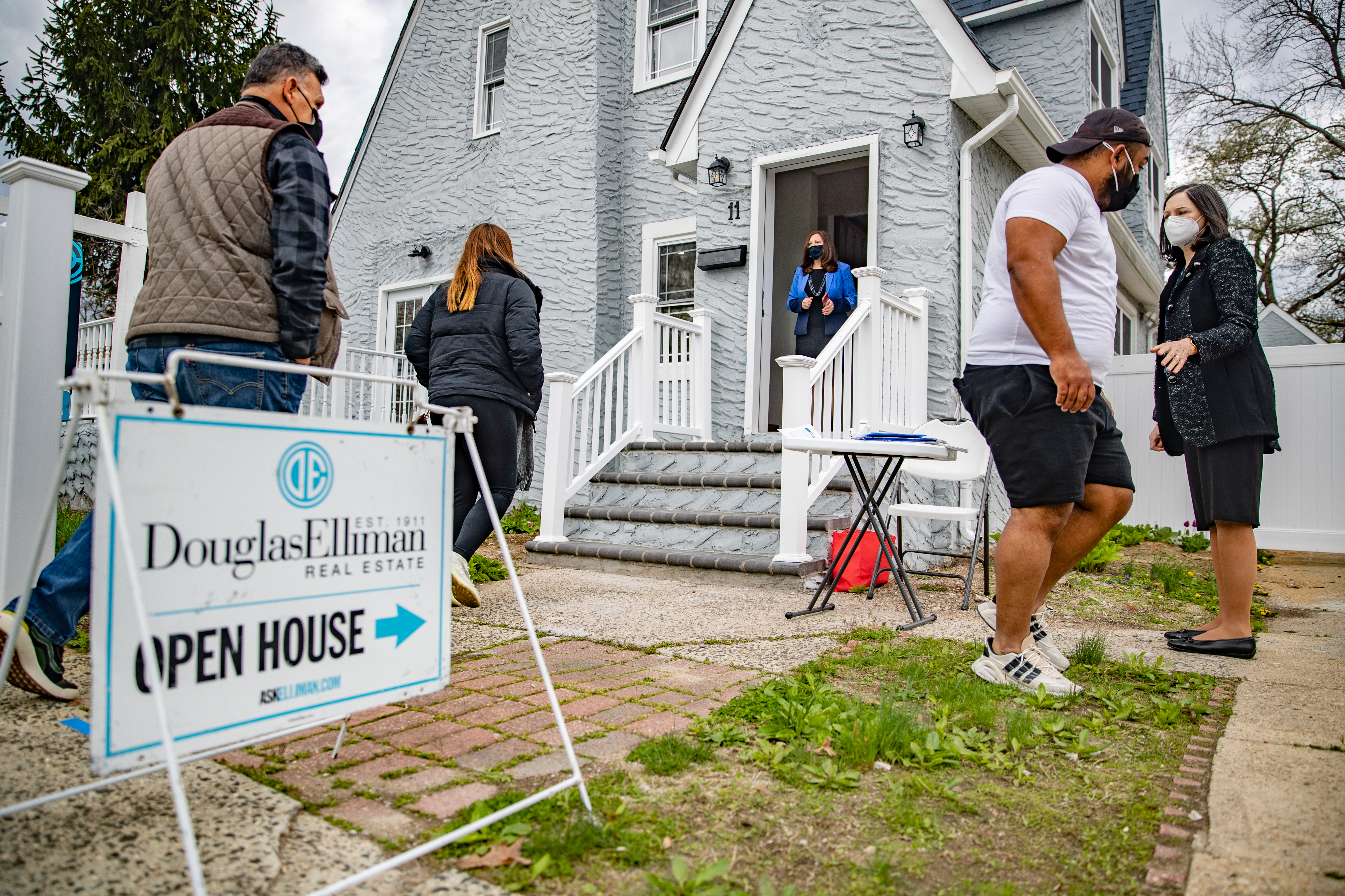 Long Island real estate agents work an open house.