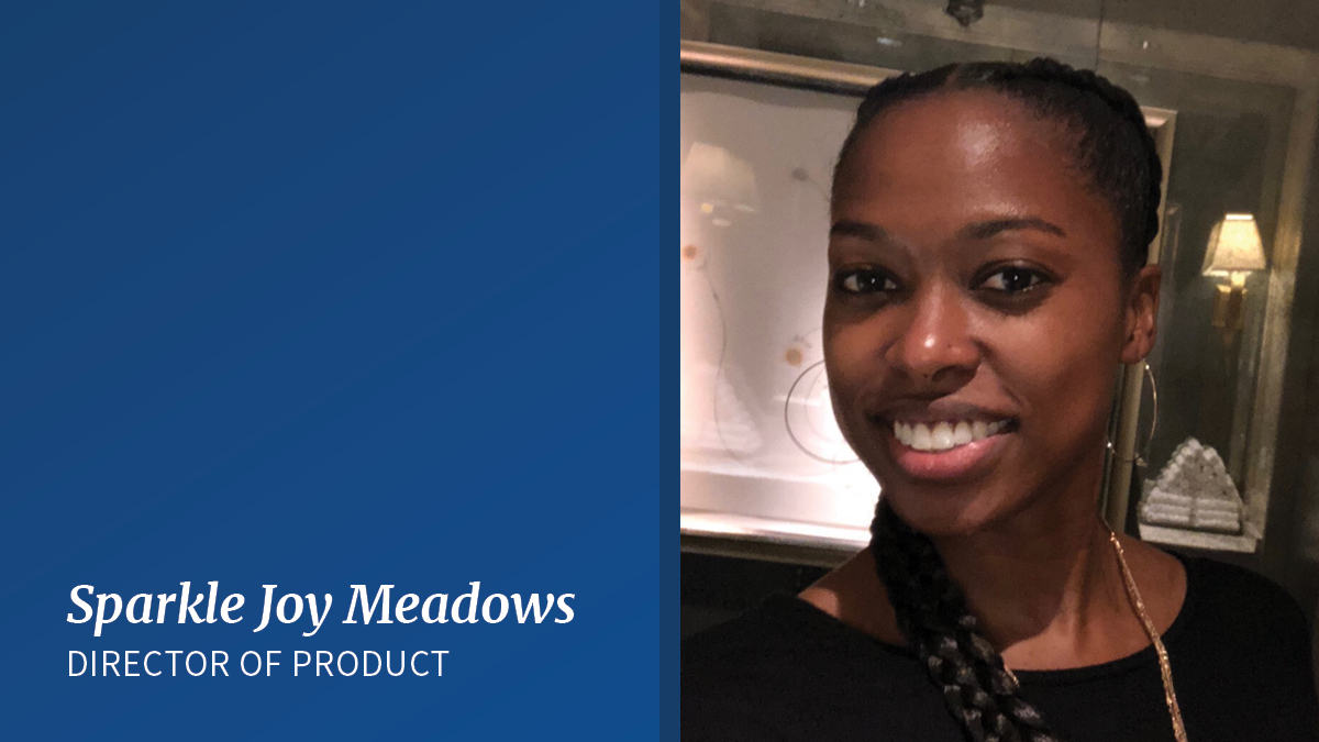 Sparkle Joy Meadows, a Black woman, is seen from her shoulders up, smiles. Her hair is in two long braids and she's wearing a black shirt and gold earrings. There is a white rectangle in the bottom left corner of the image. Blue text reads: Sparkle Joy Meadows, Director of Product. 