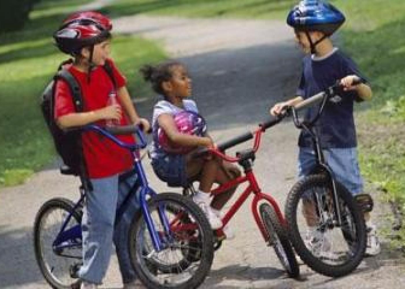 kids talking while sitting on their bikes