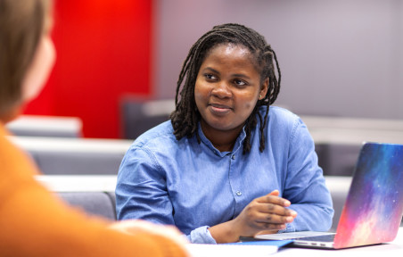 Imperial Business School Dean's Fund recipient Anita Asiedu works on a laptop