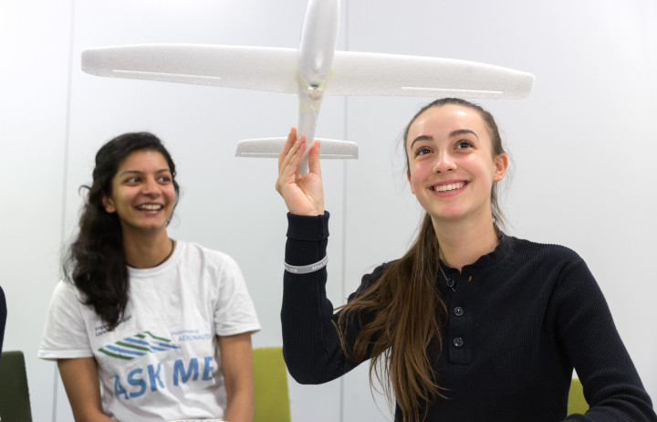 Secondary school students testing a model aircraft.