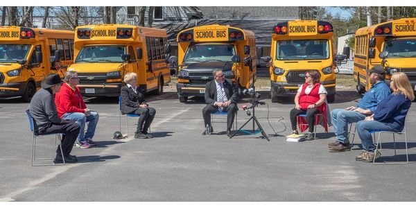 Education Secretary Miguel Cardona and U.S. Rep. Chellie Pingree visited with bus drivers,...