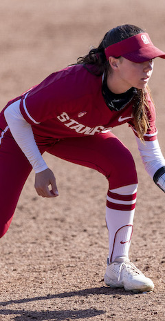 woman preparing to catch softball on field