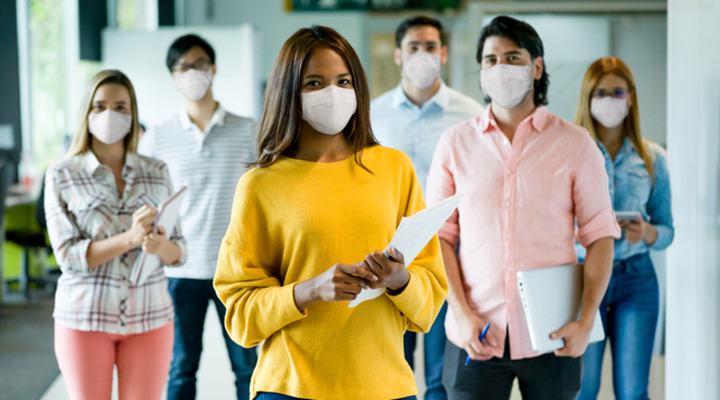 Image of diverse group of young people with masks on