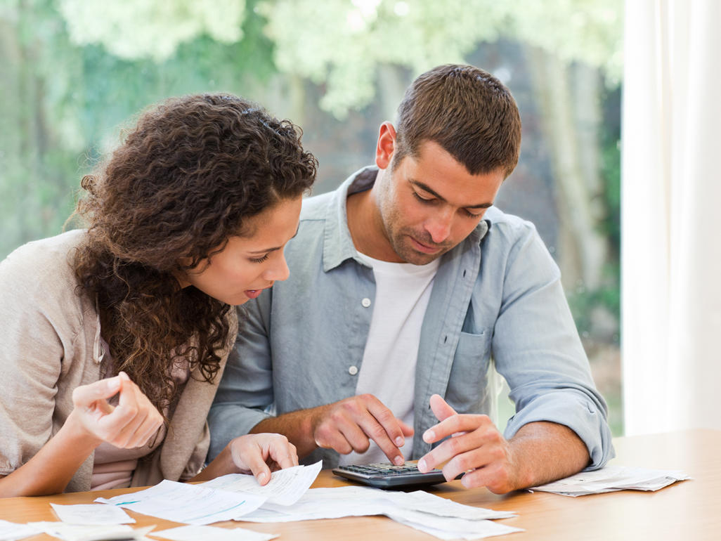 man and woman dealing with finances