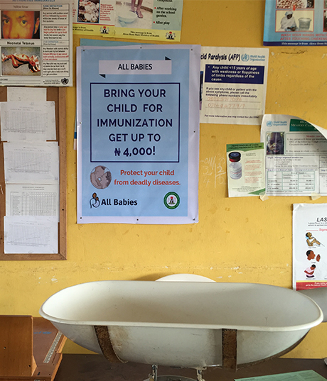 Poster at a clinic promoting awareness of the New Incentives program and the benefits of vaccination. 