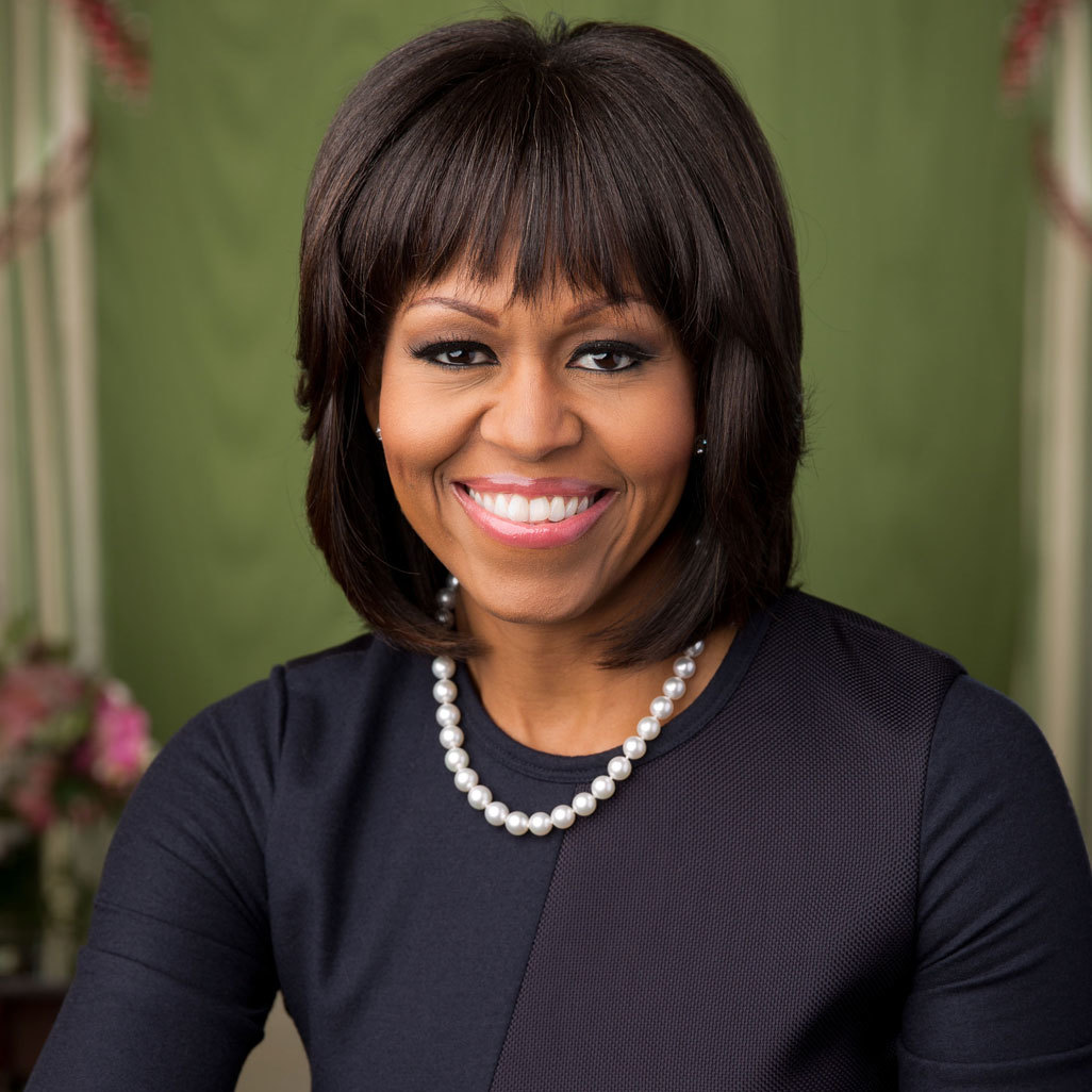 michelle obama smiling wearing pearl necklace