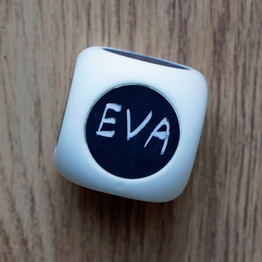 cube-like toy with eva written on top