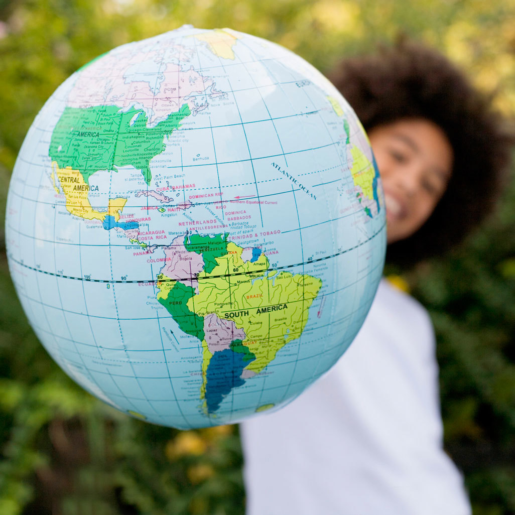 woman holding a globe