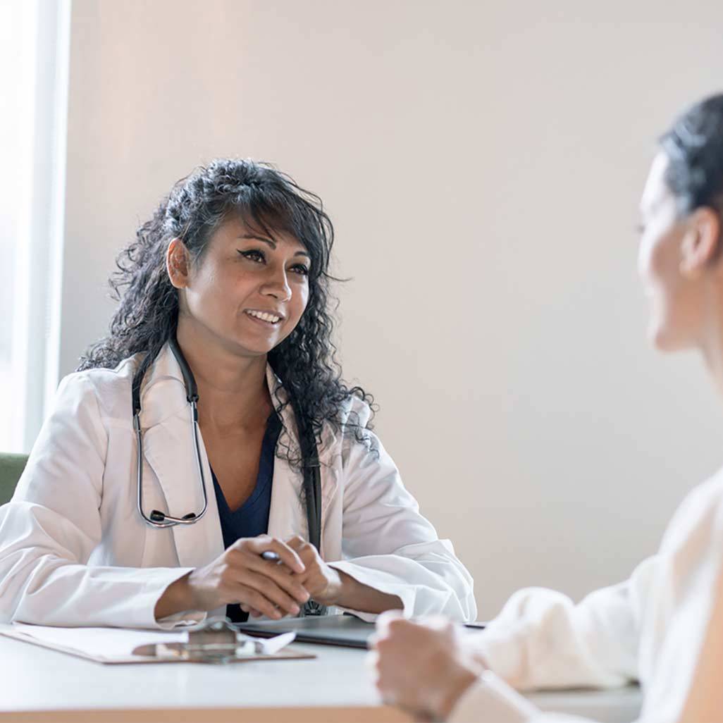 woman and doctor talking