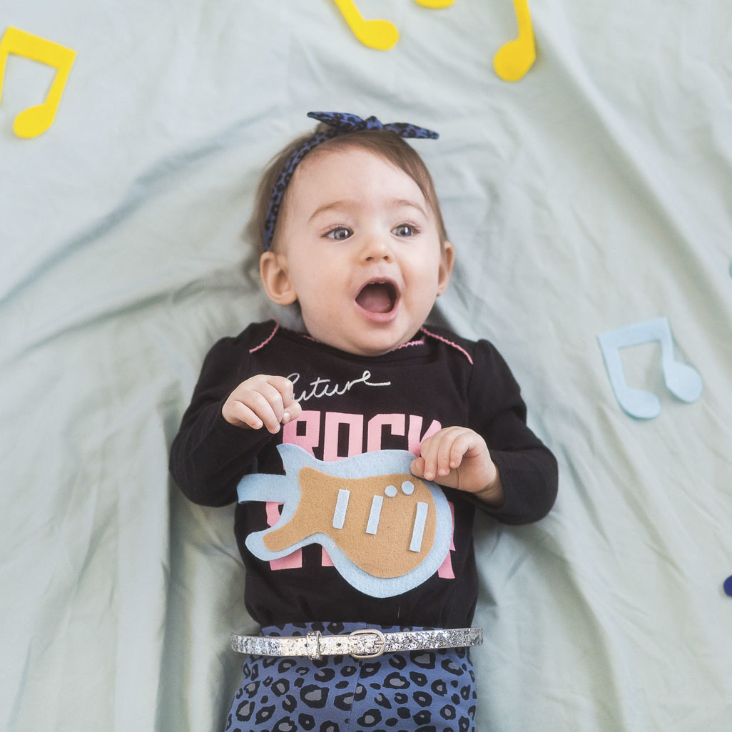 baby surrounded by music notes