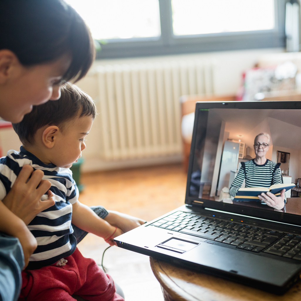 Mom and  baby video chatting with a grand mother