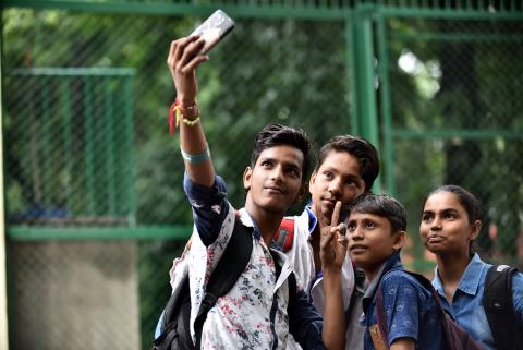 A group of teens take a selfie