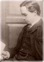 A small head-portrait of a young, pale man with dark hair.