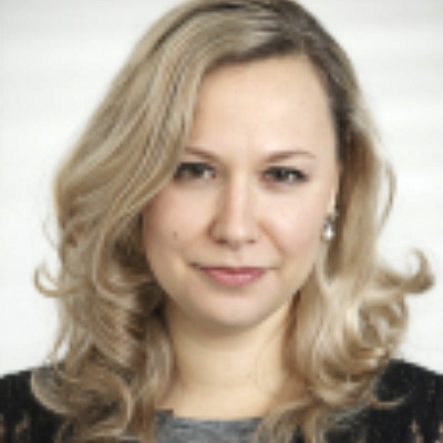 Aleksandra Kuczerawy. Postdoctoral Researcher, Centre for IT & IP Law, University of Leuven. Wearing a grey shirt and black sweater in front of a white background.