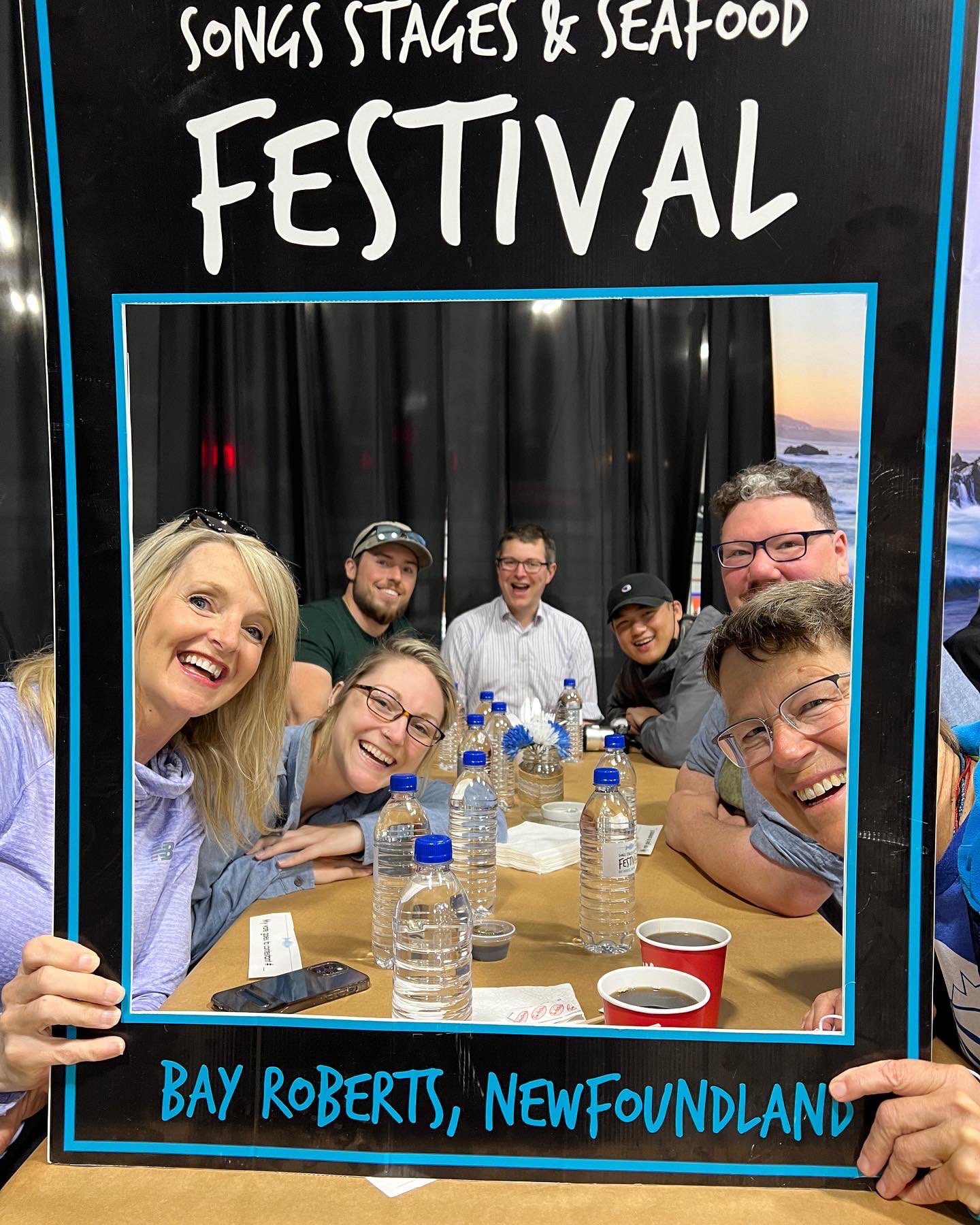 A group looks through selfie frame