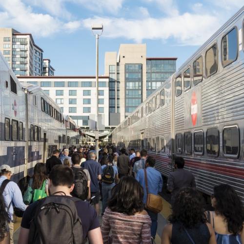 A large crowd of people at the San Francisco Caltrain Station