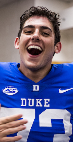 man in football uniform celebrating