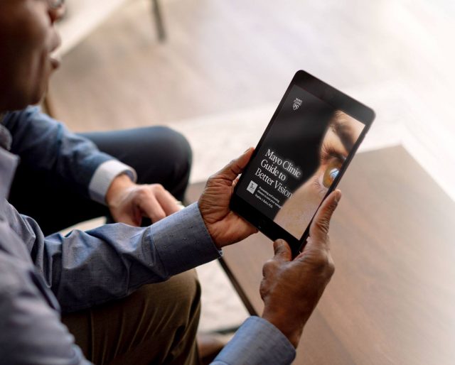 Man looking at the Mayo Clinic Guide to Better Vision on a tablet device